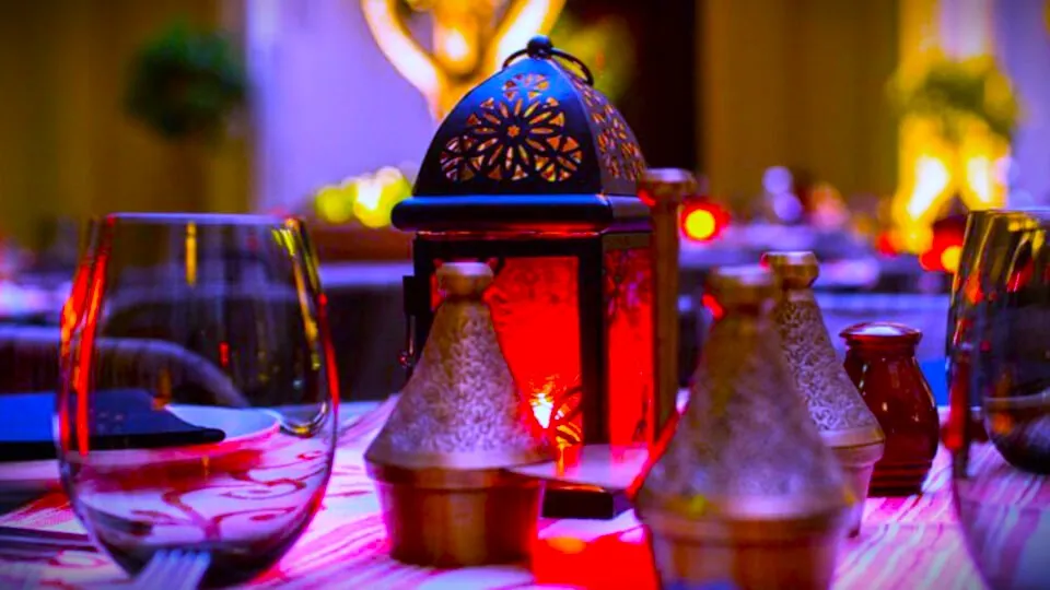 Candlelit Christmas dinner in a Moroccan riad courtyard creating a magical atmosphere.